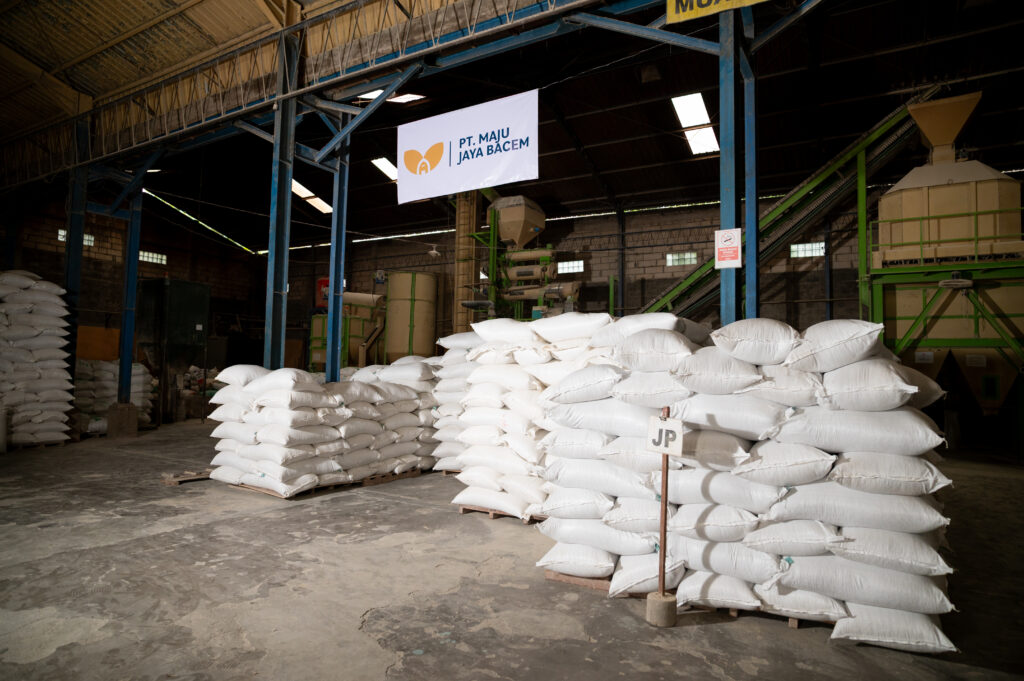 Sacks of poultry feed inside PT Maju Jaya Bacem warehouse